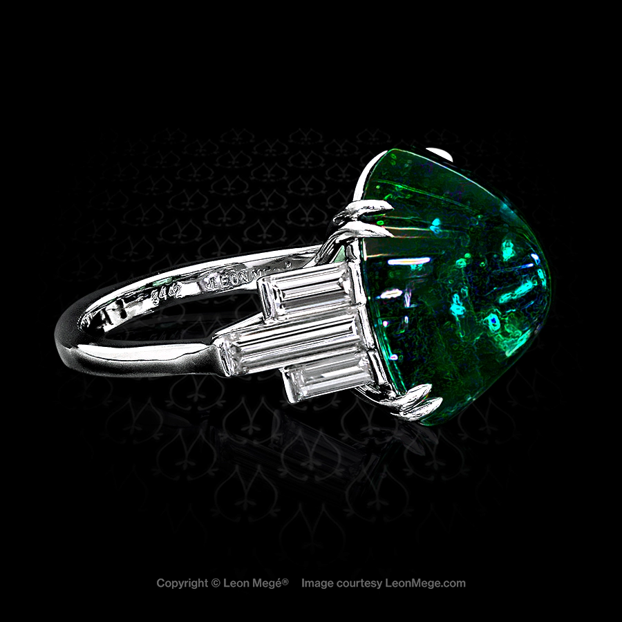 Magnificent emerald ring featuring a natural Colombian cabochonne cab by Leon Mege.