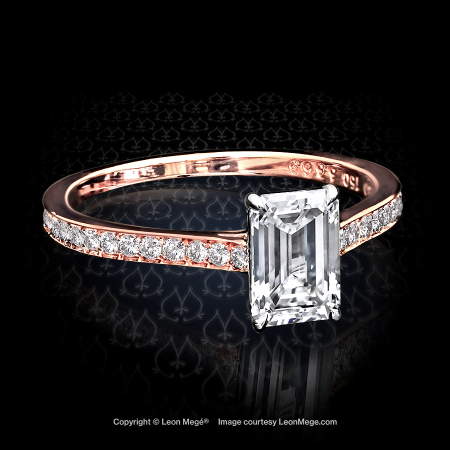 Rose gold solitaire with emerald cut diamond and bright cut pave by Leon Mege