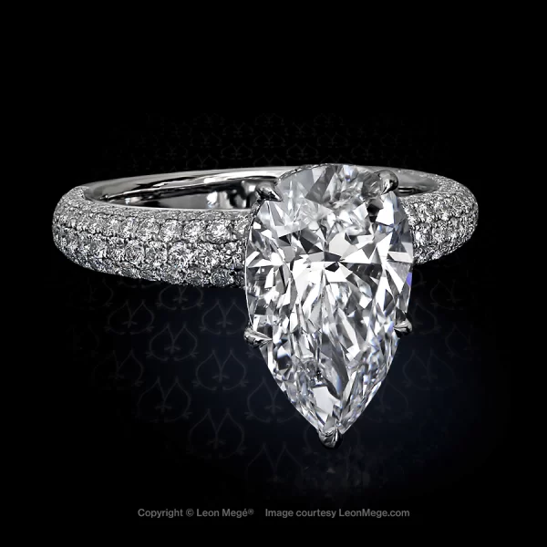Lavish engagement ring featuring a pear-shaped diamond amplified by multiple rows of micro pave r4222