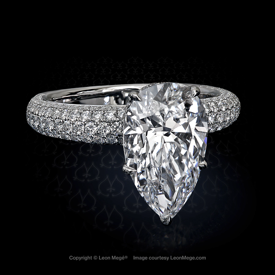 Custom made solitaire featuring a pear shaped diamond by Leon Mege.