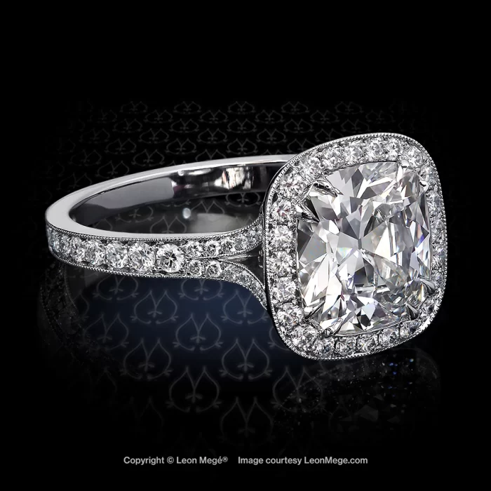 Custom made halo ring featuring a True Antique cushion diamond by Leon Mege.