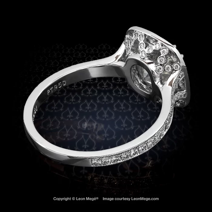 Custom made halo ring featuring a True Antique cushion diamond by Leon Mege.