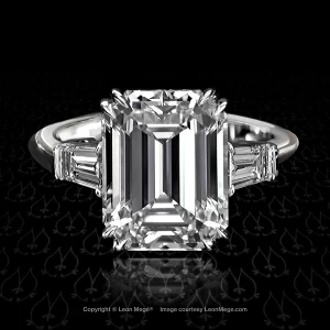 Classic three-stone ring featuring an emerald cut diamond by Leon Mege.
