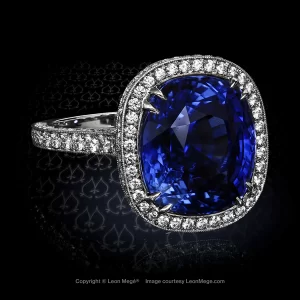 Heidy Halo ring featuring a cushion sapphire by Leon Mege.