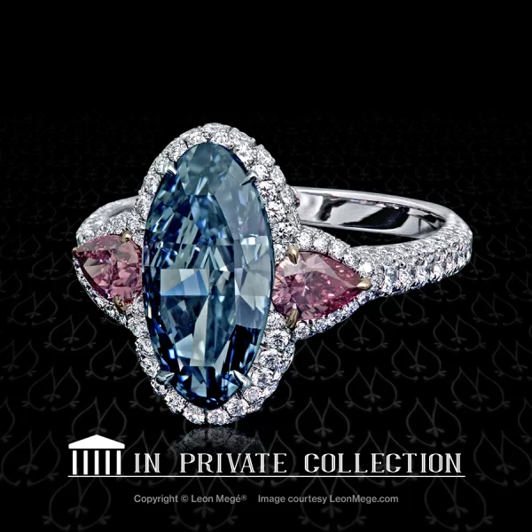 Montpassier three-stone ring featuring an oval blue diamond and two pink diamonds by Leon Mege.