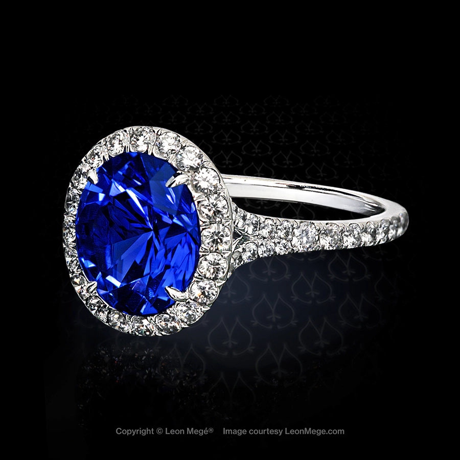 Leon Mege split shank ring with an oval sapphire nestled in diamonds cascading down on both sides r1261
