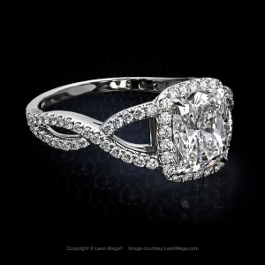 Custom halo engagement ring featuring a cushion cut diamond on a twisted shank elegantly balanced with the size of the halo r5024