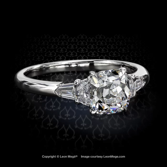 Five-stone engagement ring featuring a True Antique cushion diamond by Leon Mege.