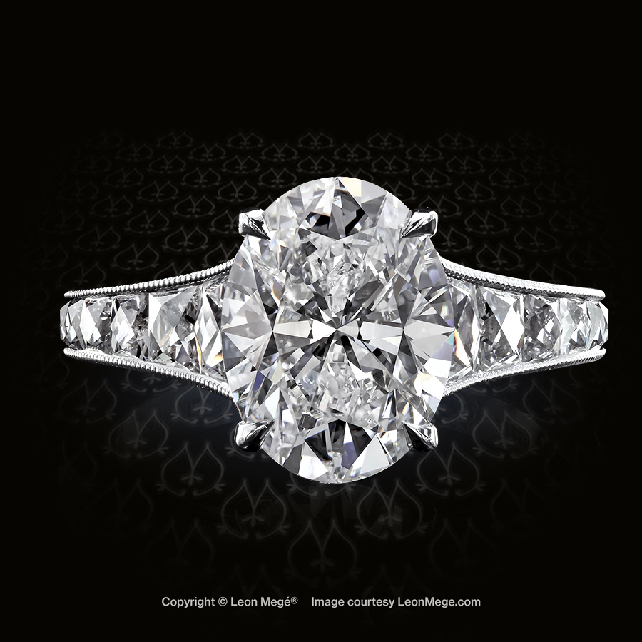 Leon Megé exclusive Mon Cheri™ ring centering natural oval diamond and channel-set French-cut diamonds with millgrain r6226