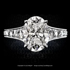 Leon Megé exclusive Mon Cheri™ ring centering natural oval diamond and channel-set French-cut diamonds with millgrain r6226