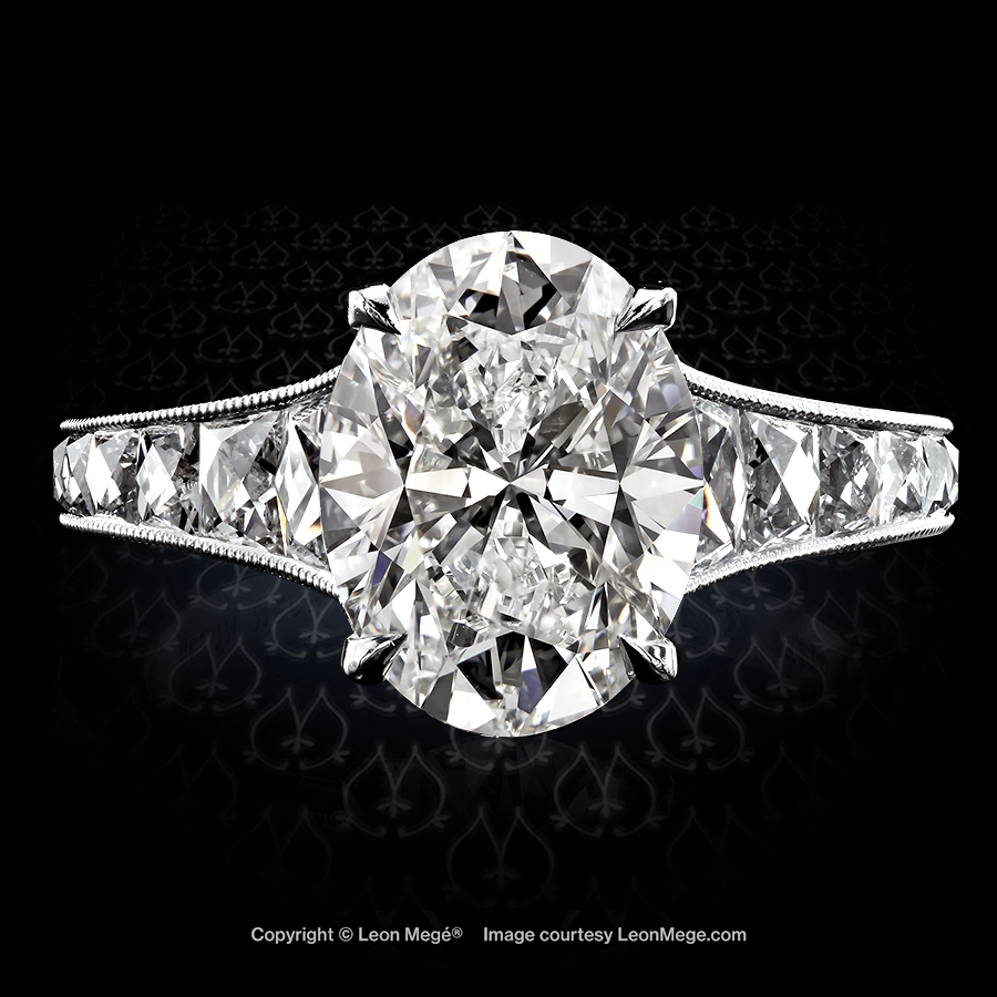 Leon Megé exclusive Mon Cheri™ ring centering natural oval diamond and channel-set French-cut diamonds with millgrain r6226