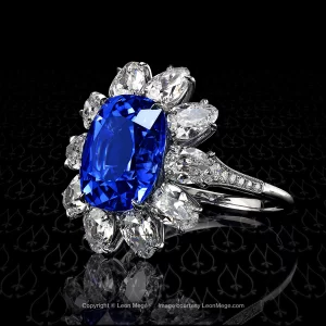 Custom made cluster ring featuring a cushion cut unheated Burmese sapphire by Leon Mege.