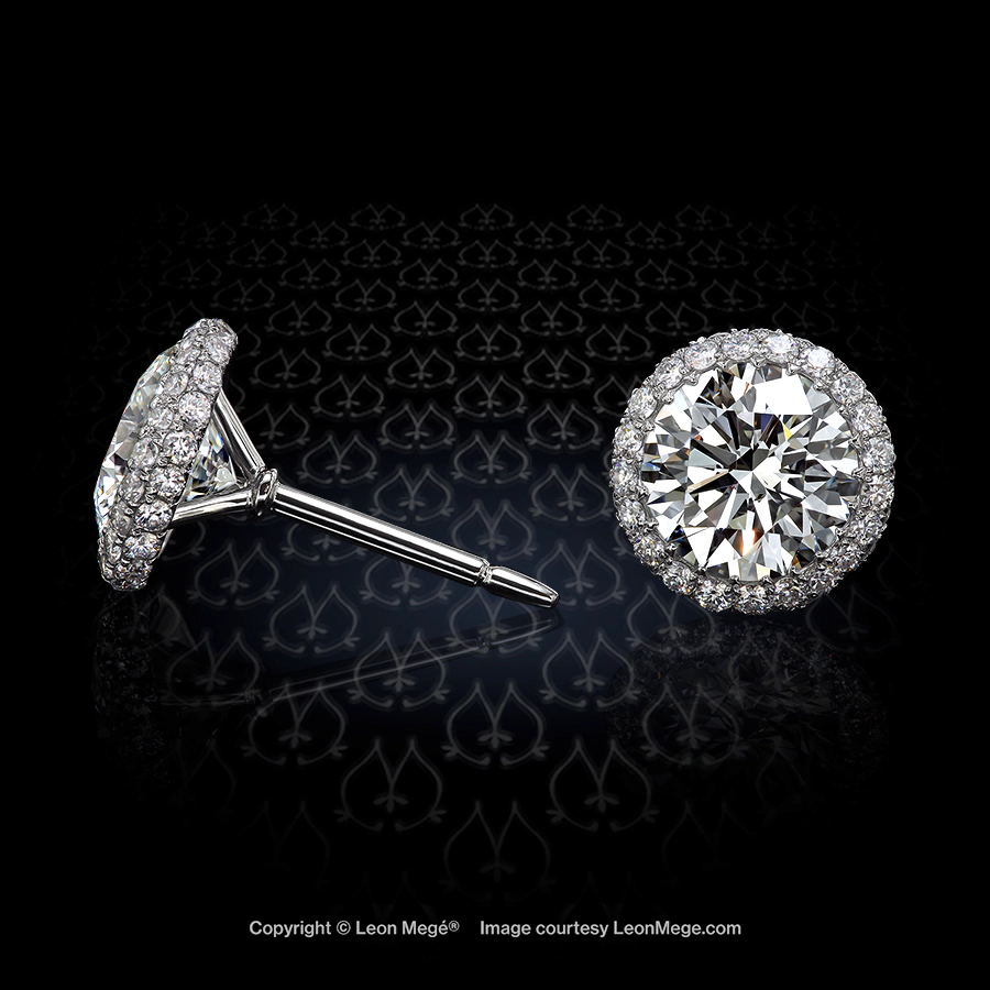 Round diamonds one carat each in micro pave diamond stud earrings by Leon Mege.