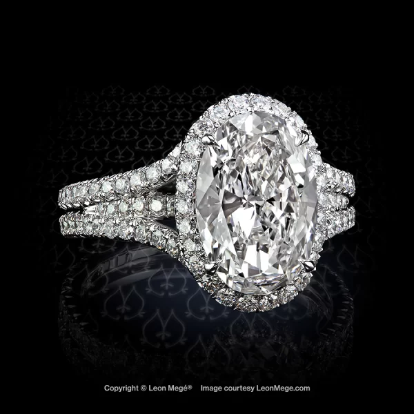 Leon Megé split shank-micro pave ring with an oval diamond in a halo hand-forged in platinum r6110