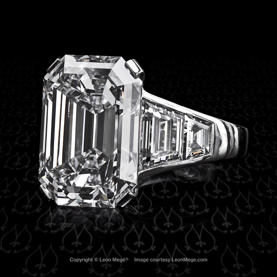 Five-stone ring featuring an emerald cut diamond by Leon Mege.
