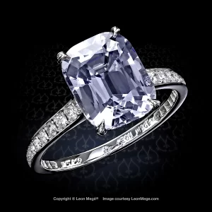 Cushion Capri spinel in a delicate engagement ring with diamonds by Leon Mege.