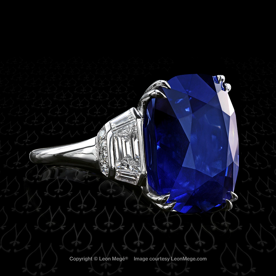Custom three stone right hand ring featuring a natural 24.00 carat cushion cut blue sapphire by Leon Mege.