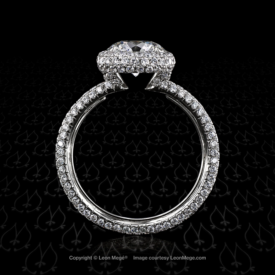 Custom made halo ring with round diamond and three rows of micro pave by Leon Mege.