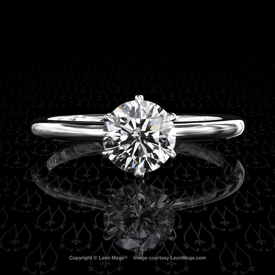 Tulip solitaire featuring a round brilliant by Leon Mege.