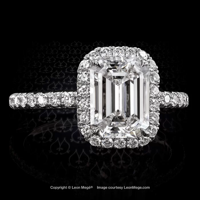 811 Halo engagement ring with emerald cut diamond surrounded with micro pave by Leon Mege