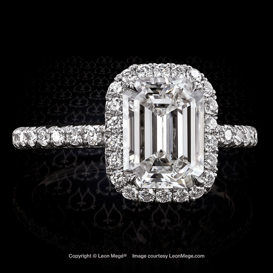 811 Halo engagement ring with emerald cut diamond surrounded with micro pave by Leon Mege