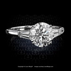 Three stone engagement ring featuring a round diamond by Leon Mege.