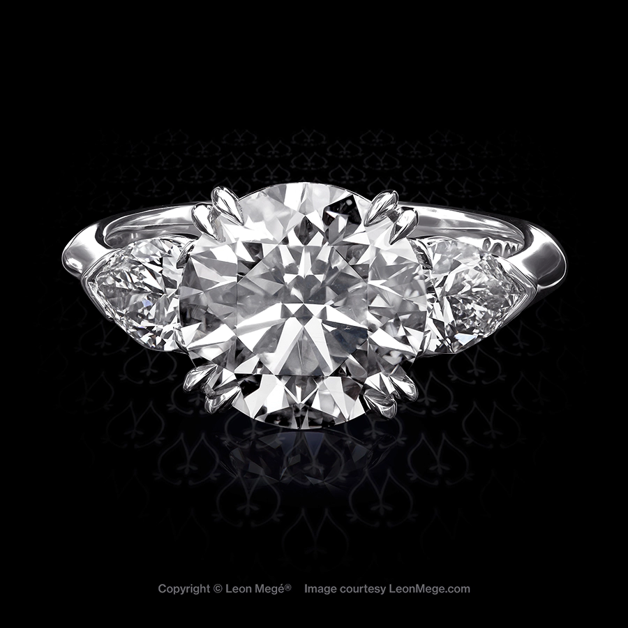 Leon Mege classic three-stone ring featuring round and pear-shape diamonds in platinum r6589
