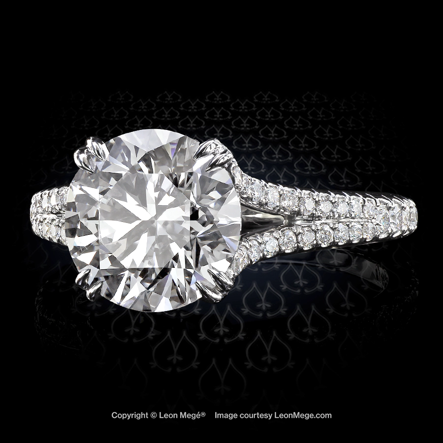 Leon Megé split shank solitaire with a round diamond in hand-forged platinum mounting r6737