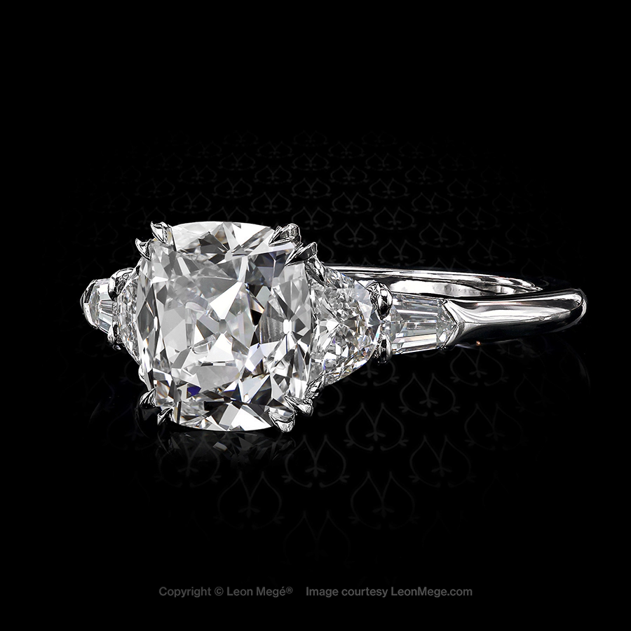 Five stone engagement ring featuring a True Antique cushion cut diamond by Leon Mege.