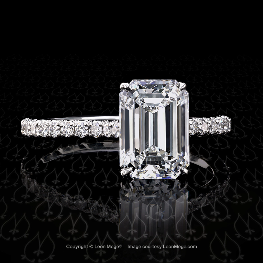 401 Solitaire featuring an Emerald cut diamond by Leon Mege.