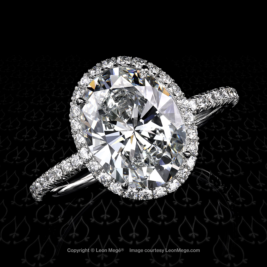 Leon Mege 811™ hand-forged engagement ring featuring a stunning oval diamond in micro pave halo r6796