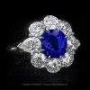 Certified natural Kashmir sapphire surrounded by certified round and pear shape diamonds in a platinum ring by Leon Mege