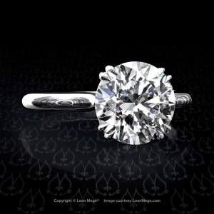 Classic solitaire ring featuring a round diamond by Leon Mege.