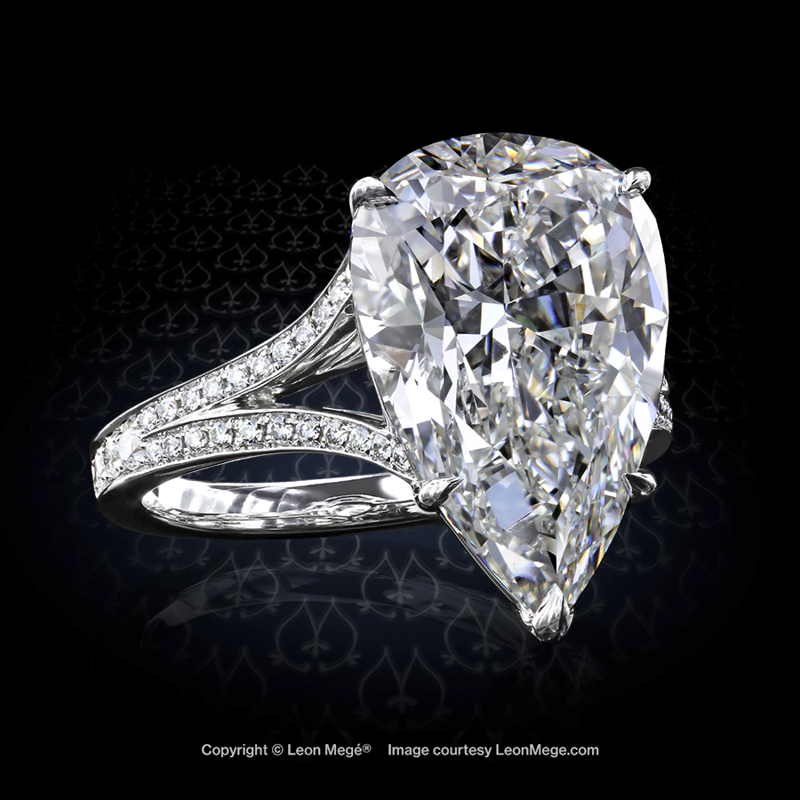 Split shank solitaire featuring a pear shaped diamond by Leon Mege.