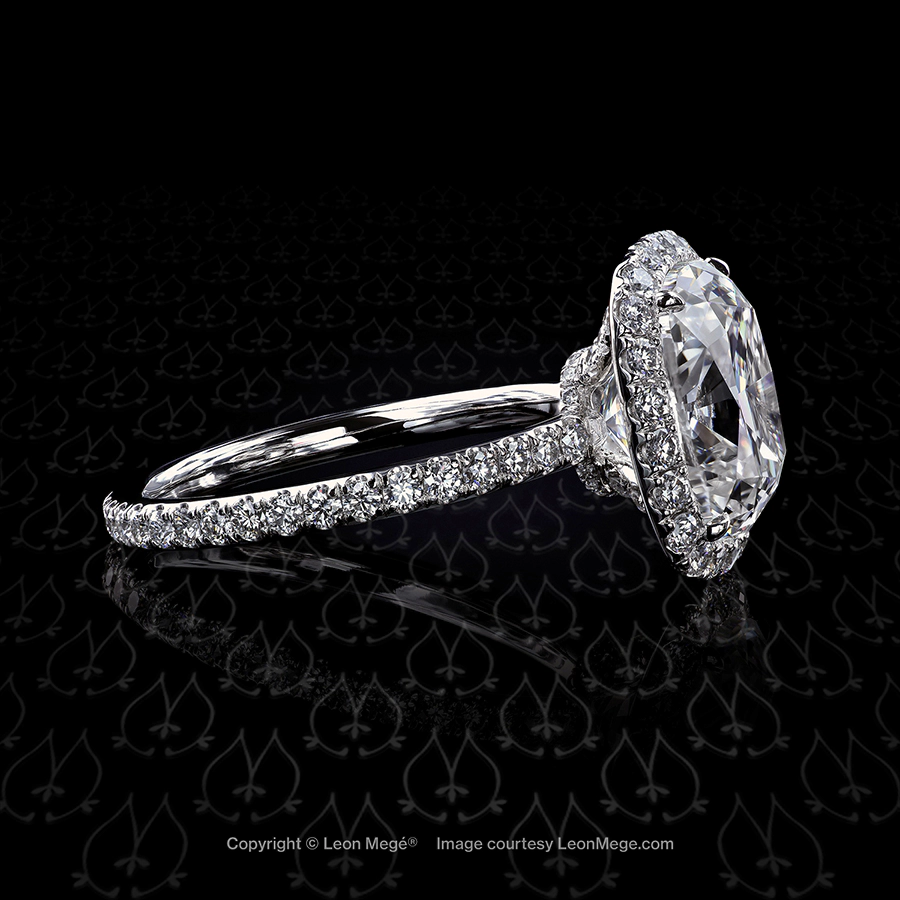Adrianna halo ring featuring a modern cushion diamond by Leon Mege.