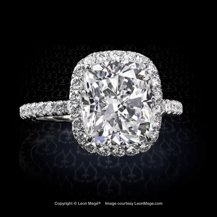 Adrianna 811 halo ring featuring a modern cushion diamond in micro pave by Leon Mege.
