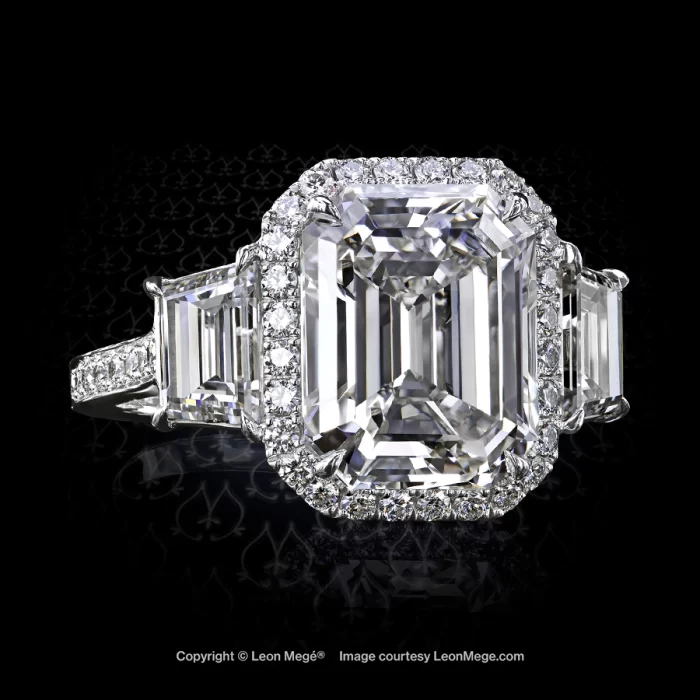 Leon Megé three-stone ring with an emerald-cut diamond in micro pave halo and trapezoids r6994
