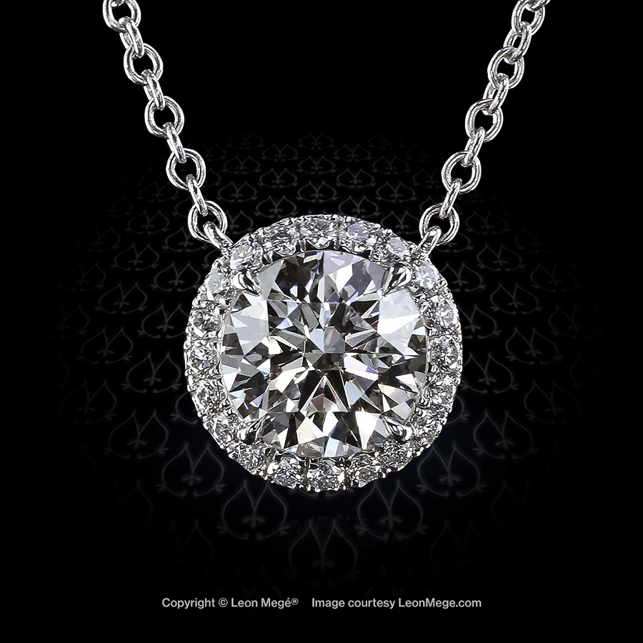 Custom made halo pendant featuring a round diamond by Leon Mege.