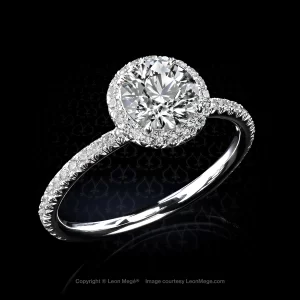 811 halo ring featuring 1.01 carat round cut diamond in a micro pave halo by Leon Mege.