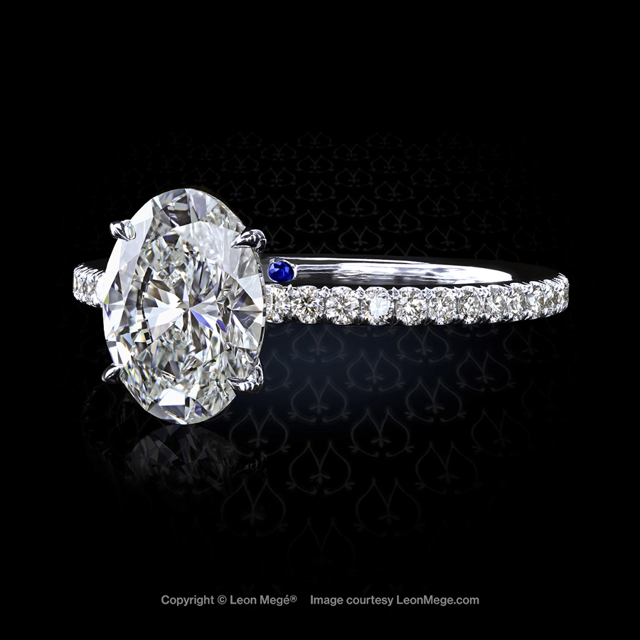401 solitaire featuring an oval shaped diamond by Leon Mege.