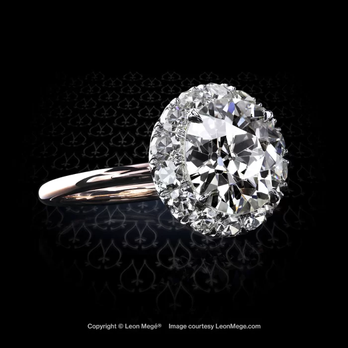 810 halo ring featuring an Old European cut and single eight cut diamonds by Leon Mege.