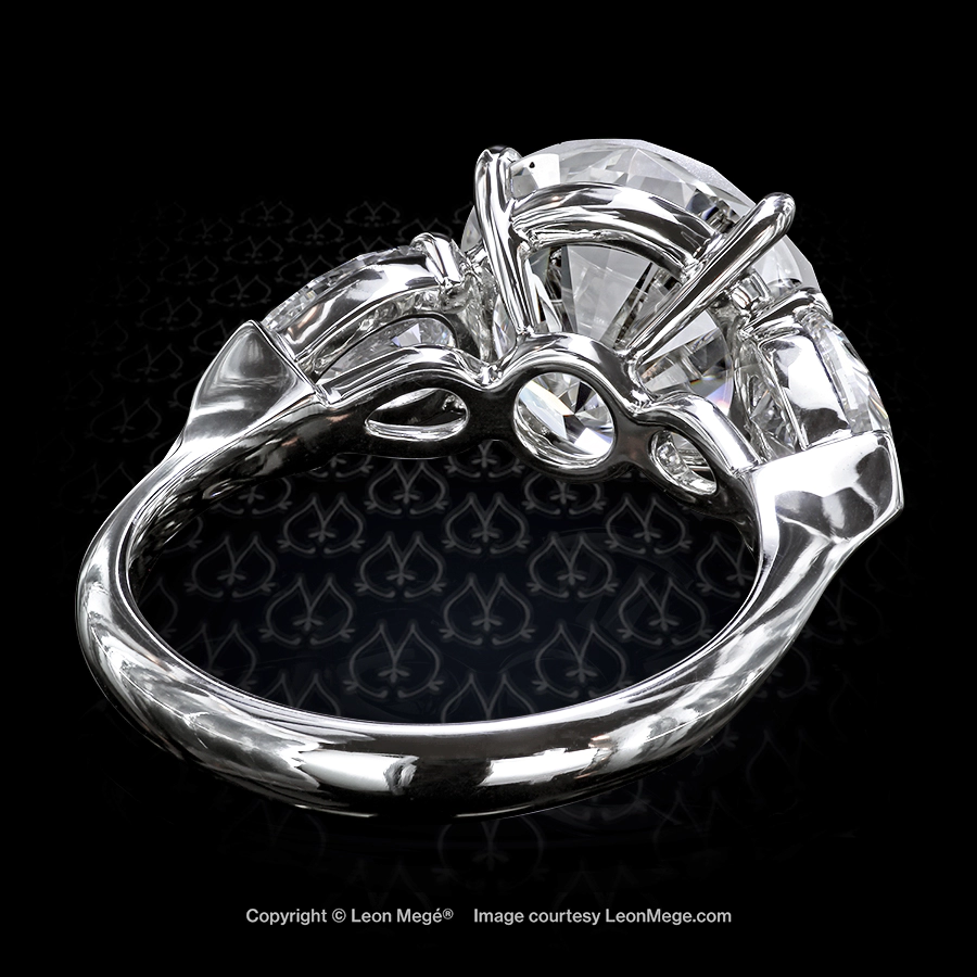 Leon Megé hand-forged classic three-stone ring with a round diamond and pear-shaped side stones r6986