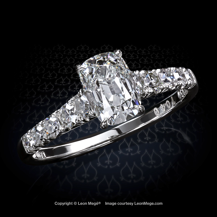 Custom made solitaire featuring a True Antique cushion with single cut diamonds by Leon Mege.