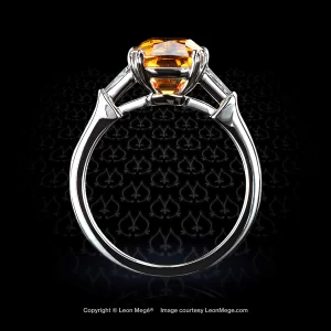 Three-stone couture ring featuring a cushion Mandarin garnet by Leon Mege.