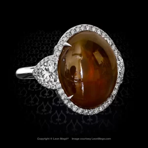 Montpassier three-stone ring featuring a cabochon brown Alexandrite by Leon Mege.