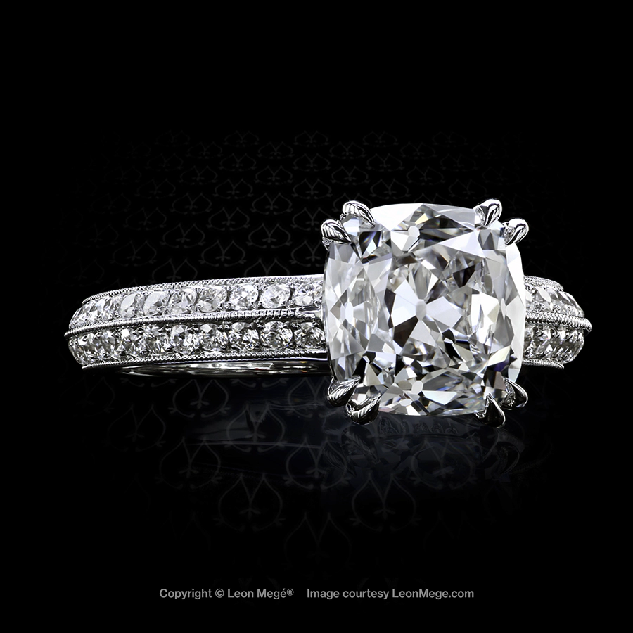 Custom made solitaire featuring a True Antique cushion diamond by Leon Mege.