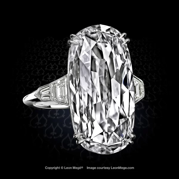 Unique five-stone ring featuring a rose cut oval diamond with diamond trapezoids and bullets by Leon Mege.