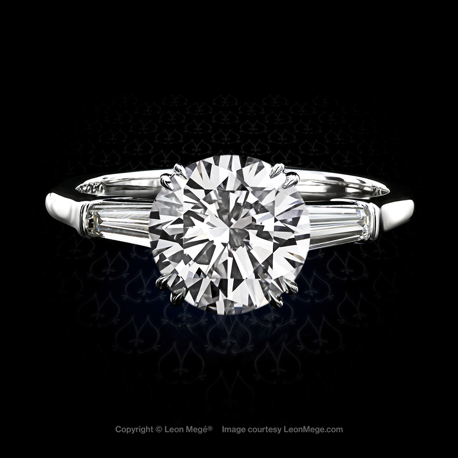 Classic three-stone ring featuring a round diamond by Leon Mege.