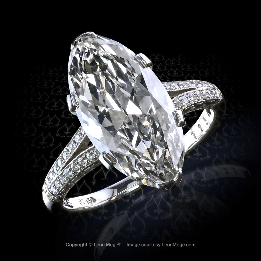 Hand made Art Deco style engagement ring with a moval diamond by Leon Mege.
