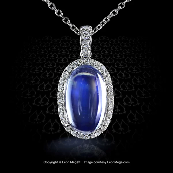 Leon Megé bespoke pendant with an oval moonstone cab surrounded by micro pave halo and hung on a platinum chain with diamond-set bail p7353
